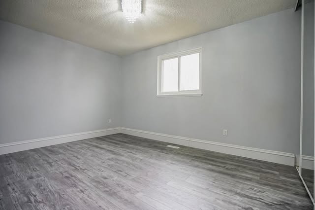 Finished basement renovation with vinyl plank flooring, Brampton