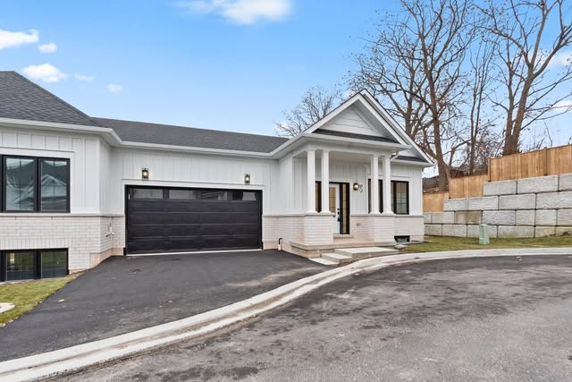 Custom home exterior with new garage and driveway, Brampton
