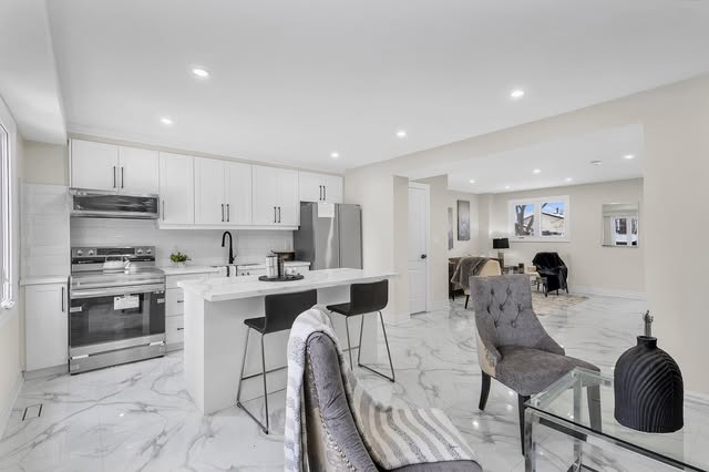 Custom kitchen renovation with built-in wall ovens and island, Mississauga