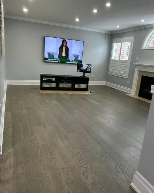 Family room renovation with fireplace and custom window shutters, Caledon