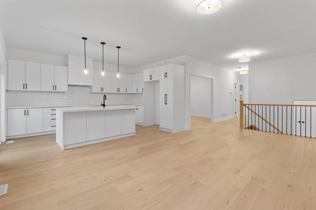 Open-concept kitchen and living area renovation with hardwood flooring, Brampton GTA